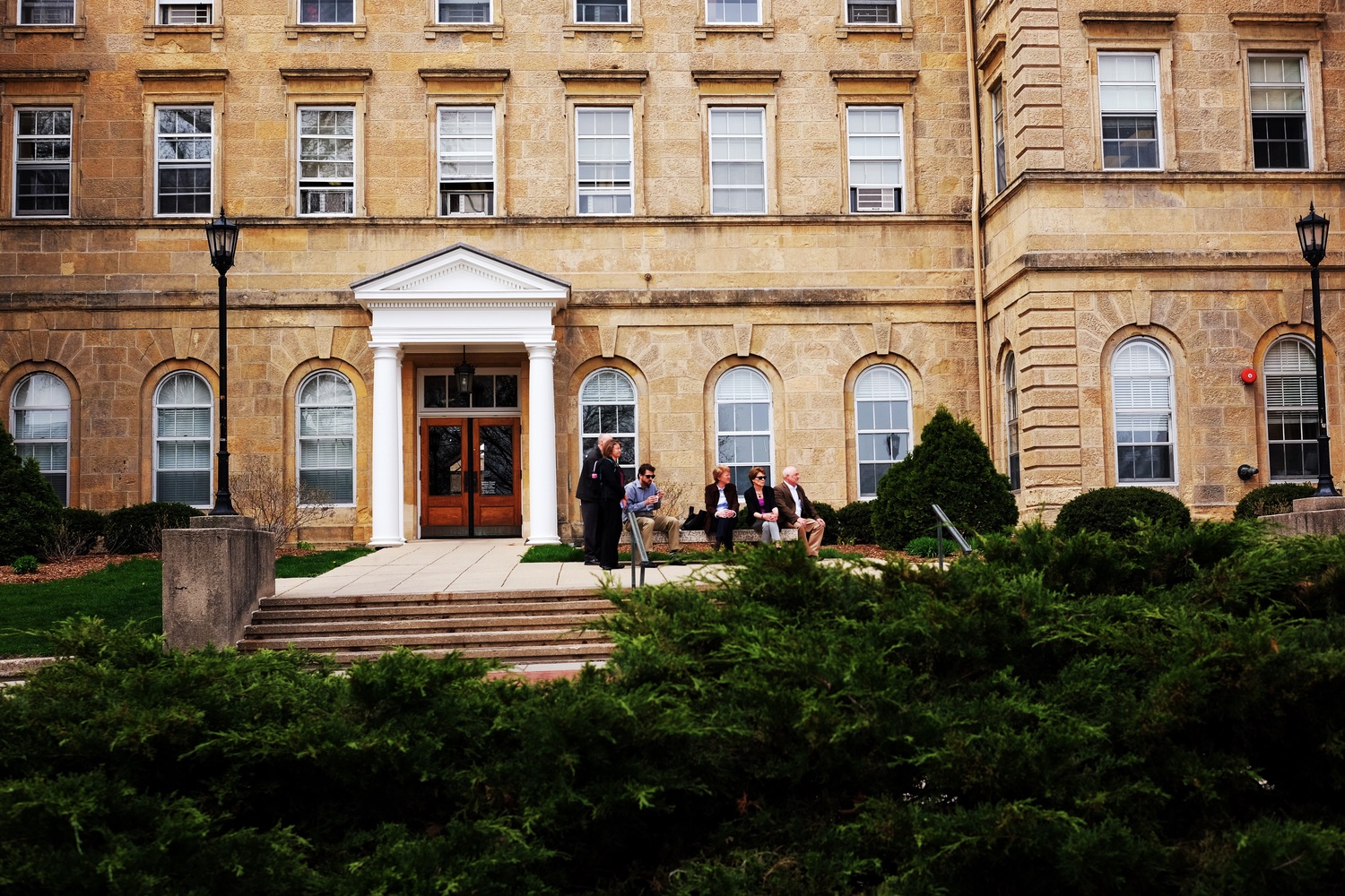 Dean of Students Lori Berquam, Provost Sarah Mangelsdorf, and others observe from afar just outside their offices in Bascom Hall.